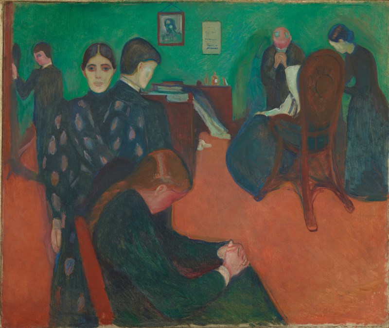 Sørgende familiemedlemmer i et rom med grønn vegg og oransje gulv. I forgrunnen sitter en ung jente med bøyd rygg. Flere voksne står i ulike stillinger rundt henne, preget av sorg og ettertanke.