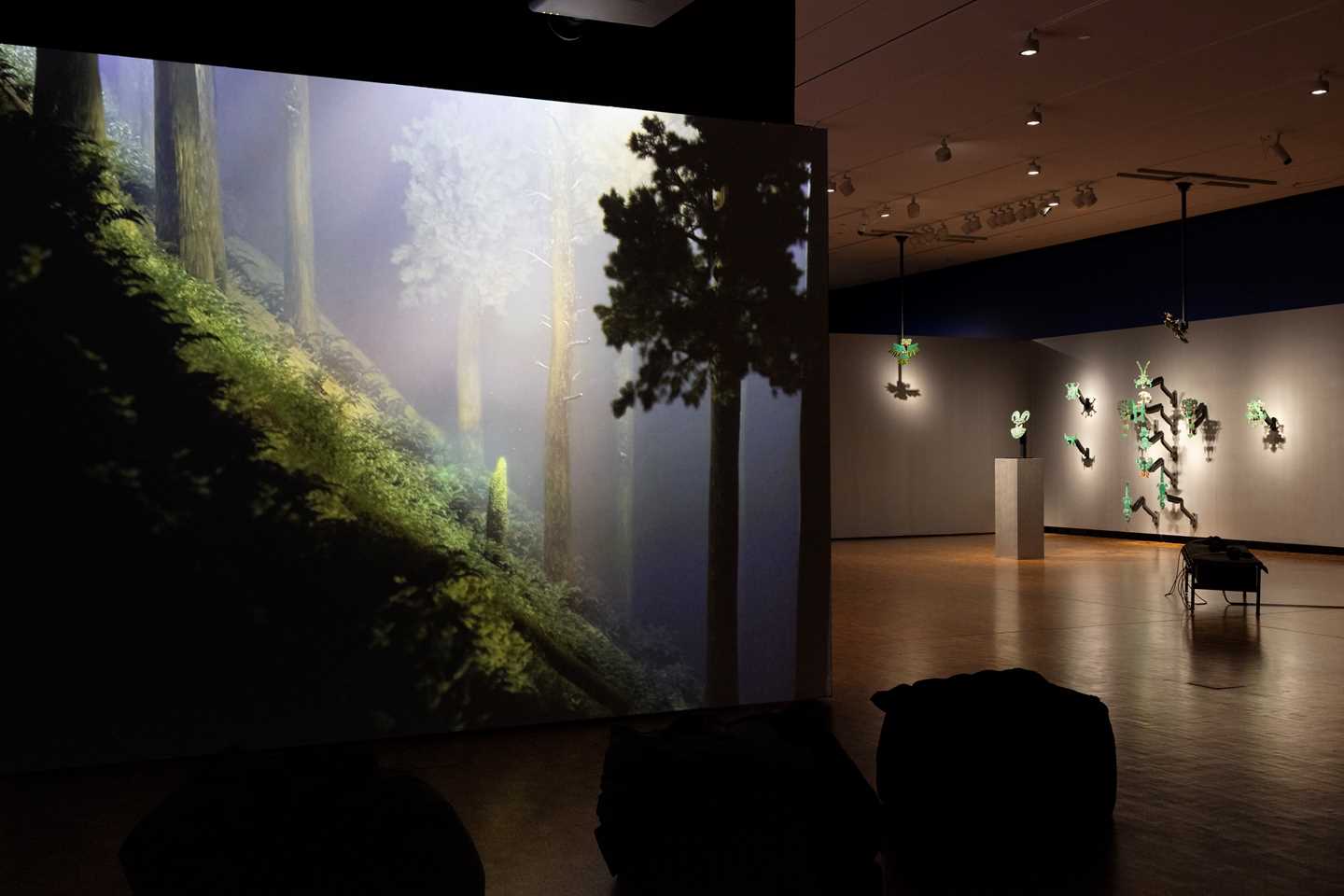 The work Finding Bambi by Sven Påhlsson, showing a steep forested slope, is a handcrafted virtual representation of a woodland landscape. Photograph.