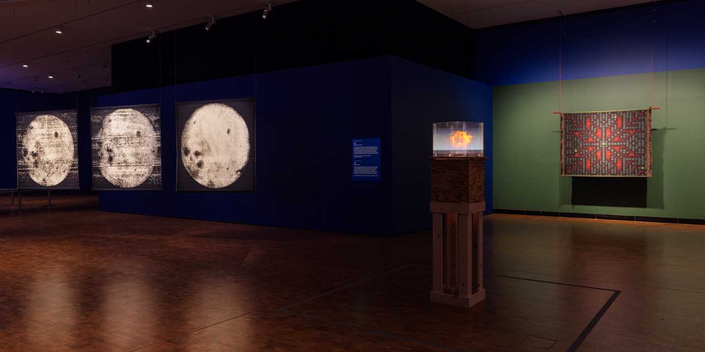 A section of the exhibition hall for MUNCH Triennale – Almost Unreal, showing three of the works on display. Photograph.
